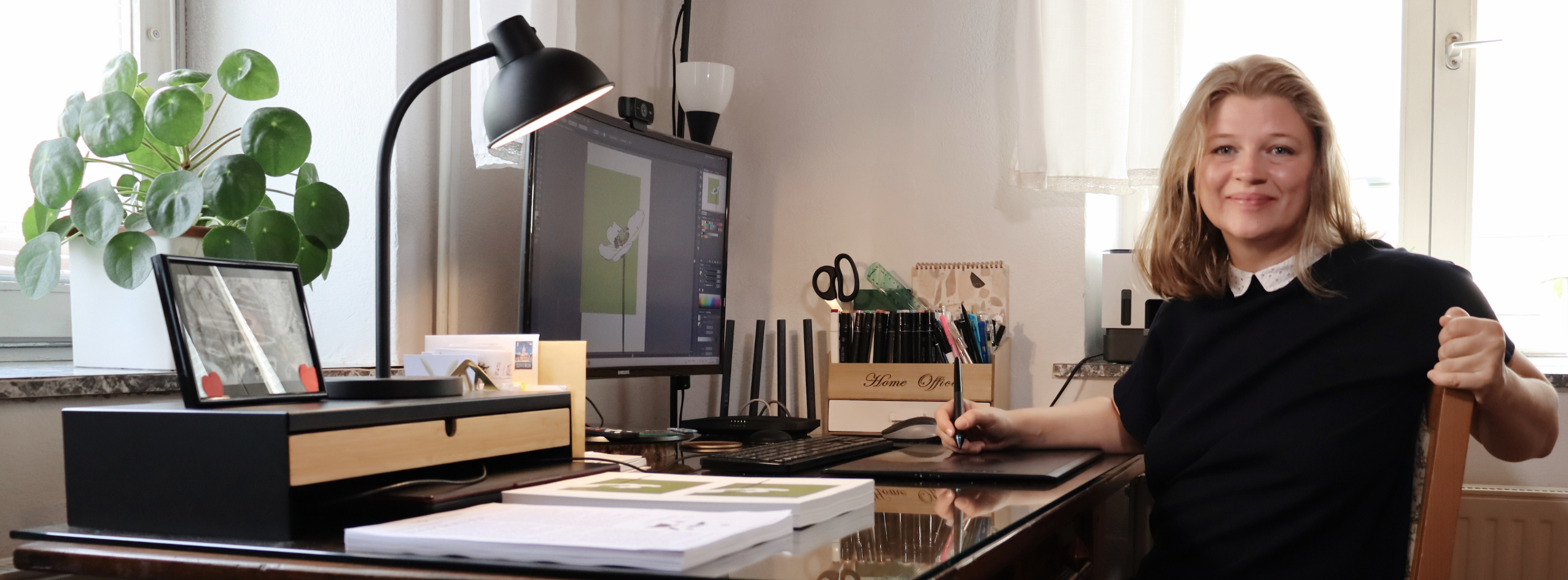 Talja creating original art at her workspace for Talja's Blessings